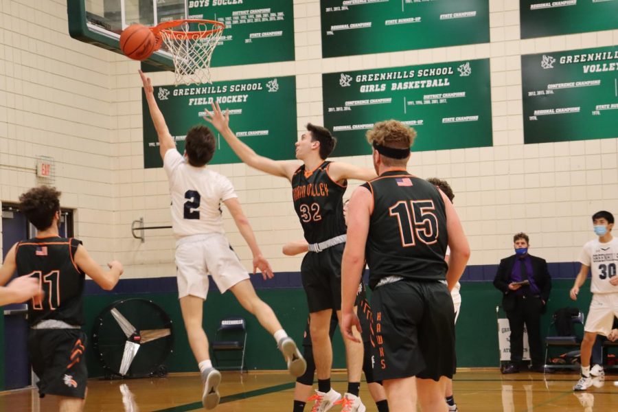 ATTACKING THE RIM Finn Klein 22 drives to the rim for a bucket. My ability to attack the rim has developed from my freshman year as Ive gotten more experience and stronger, Klein said.