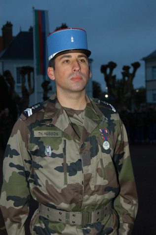 VIVE LA FRANCE Husson on a military base in Tours France being awarded the Silver National Medal in 2005. “I went  to teach at a Military academy and I was teaching a leadership course,” said Husson.