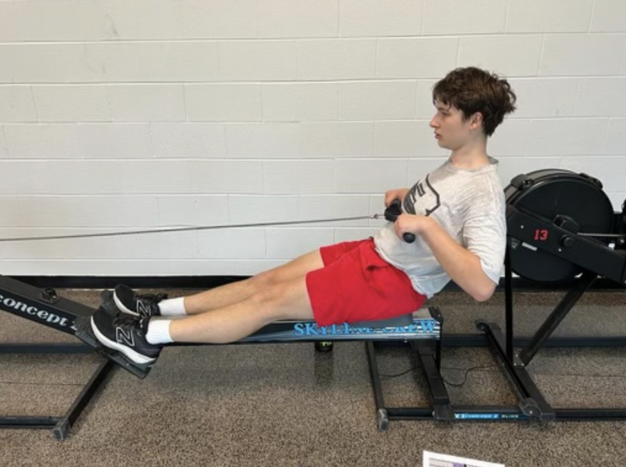 PORT-SIDE PERFORMANCE Thomas Stoffel rows on machine during off-season. For the winter season we go to [Ann Arbor] Skyline to do conditioning on their machines, said Stoffel. Its hard work for sure but it prepares us for when we go out on the water in the spring.