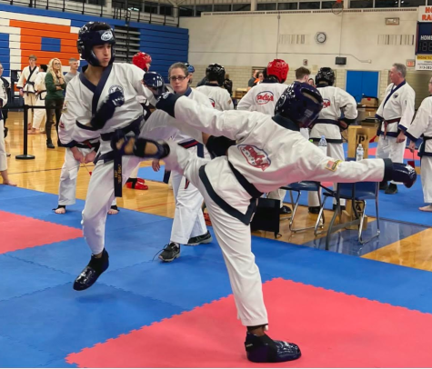 KICK ME WITH YOUR BEST SHOT Yousif Ogaily ‘24 faces off at the 2023 State Championships for kickboxing. “I really enjoy the heat of competition,” said Ogaily. “I am able to show what I can do and what I have been working towards for the last 6 years.”
