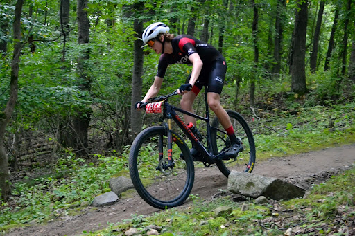 ROUGH TERRAIN Beck races on a hilly and rocky course on his mountain bike. “I like longer courses because of the terrain and how it’s not just the same thing over and over,” Beck said. “On these courses, it’s about navigating the hills and maintaining a good pace because the course is so long.”
