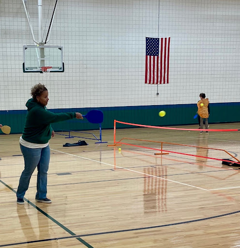 GAME ON Head of Middle School Mayra Diaz participates in a pickleball match at the club. “In Pickleball Club, I really enjoy getting to play, and thats why I have a Pickleball Club,” Diaz said. 
