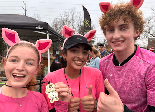 RUNNING WITH STYLE Ava Kittendorf ‘24, Anika Bery ‘24, Henry Beck ‘26, and Lincoln Cha ‘24 (not pictured) get ready to run the race with some fun costumes to add to the experience. “It was so fun,” said Kittendorf. “I definitely want to run more long races like this in the future.”
