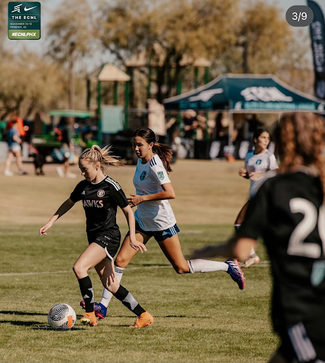 THREAT UNLEASHED Charlotte McMurtrie ‘26 carries the ball up the field to pass to a forward. “I like playing midfield because I get the ball a lot and I get a lot of assists.” McMurtrie said. “I’ve tried other positions like forward but my favorite by far is midfield.”
